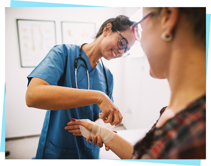 Image of medical practitioner applying a bandage to a patient's wrist